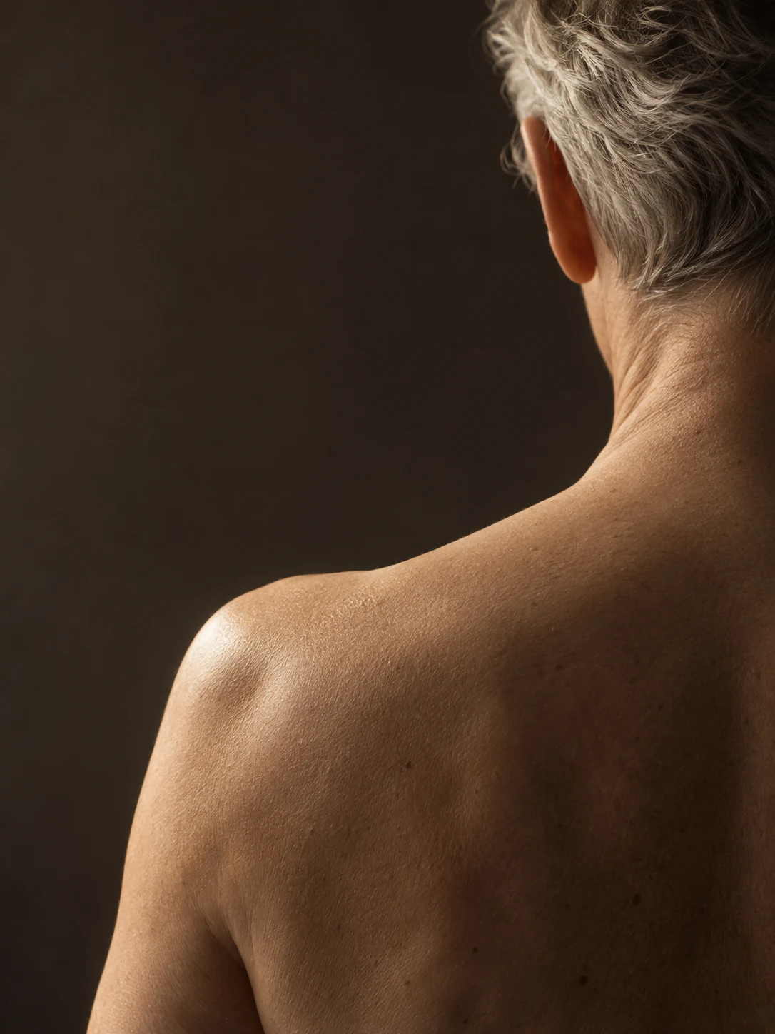 A study of a human shoulder in gentle light, connecting protein design with human health